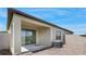Backyard patio with sliding glass doors and brick pavers at 13423 Crest Lake Dr, Hudson, FL 34669