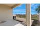 Backyard patio featuring a covered porch area with views of neighboring homes at 13423 Crest Lake Dr, Hudson, FL 34669