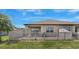 A fenced backyard featuring a well-manicured lawn and patio at 13423 Crest Lake Dr, Hudson, FL 34669