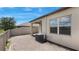 The brick-paved patio has a covered section for shade and a view of the fenced backyard at 13423 Crest Lake Dr, Hudson, FL 34669