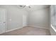 Bedroom with carpet flooring, window with blinds, and closet access at 13423 Crest Lake Dr, Hudson, FL 34669
