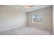 Neutral bedroom with carpet and a large window with blinds for natural light at 13423 Crest Lake Dr, Hudson, FL 34669