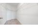 Walk-in closet featuring carpet flooring and wire shelving for storage at 13423 Crest Lake Dr, Hudson, FL 34669