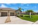 Charming home featuring a two-car garage, well-maintained lawn, and a welcoming driveway at 13423 Crest Lake Dr, Hudson, FL 34669