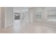 Open living space featuring tile flooring, lots of natural light, and a sliding door to the patio at 13423 Crest Lake Dr, Hudson, FL 34669