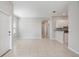 Open living space featuring tile flooring, modern lighting, and an open-concept layout at 13423 Crest Lake Dr, Hudson, FL 34669