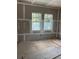 Bedroom with two windows offering bright, natural light and unfinished floors for customization at 1435 17Th N Ave, St Petersburg, FL 33704