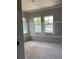 Bedroom featuring unfinished walls and multiple windows providing natural light at 1435 17Th N Ave, St Petersburg, FL 33704