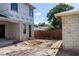 An unfinished exterior shows a block construction and a garage at 1435 17Th N Ave, St Petersburg, FL 33704