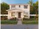 Charming two-story home featuring a welcoming front porch with columns and beautifully landscaped yard at 1435 17Th N Ave, St Petersburg, FL 33704