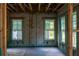 The framed interior shows window placement, masonry and the room layout of a new home under construction at 1435 17Th N Ave, St Petersburg, FL 33704