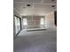 Spacious living room featuring large windows for natural light and sliding door access to the outdoors at 1435 17Th N Ave, St Petersburg, FL 33704