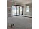 Spacious living room featuring sliding glass doors and ample natural light, awaiting your personal design and finishing touches at 1435 17Th N Ave, St Petersburg, FL 33704