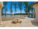Spacious stone patio features beautiful water views, garden, and comfortable seating at 17124 Crawley Rd, Odessa, FL 33556