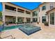 Luxury backyard features a swimming pool, hot tub, and ample patio space for outdoor entertaining at 17124 Crawley Rd, Odessa, FL 33556