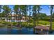 Lakeside property featuring a covered patio, perfect for enjoying serene views and outdoor relaxation at 17124 Crawley Rd, Odessa, FL 33556