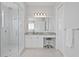 Bathroom featuring glass enclosed shower, white cabinets, and vanity with lots of natural light at 17124 Crawley Rd, Odessa, FL 33556