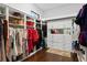 Spacious walk-in closet with custom shelving and storage solutions, ensuring a clutter-free and organized space at 17124 Crawley Rd, Odessa, FL 33556