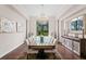 Elegant dining room featuring a glass table, a sparkling chandelier, and decorative art that adds sophistication at 17124 Crawley Rd, Odessa, FL 33556