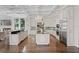 Gourmet kitchen with custom cabinetry, granite countertops, stainless steel appliances and a large island at 17124 Crawley Rd, Odessa, FL 33556