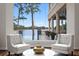 Bright living area features stylish furnishings, large windows with water views, and access to an outdoor balcony at 17124 Crawley Rd, Odessa, FL 33556