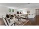 Bright living room with hardwood floors, elegant furniture, and many windows at 17124 Crawley Rd, Odessa, FL 33556
