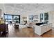 Open-concept living space with gourmet kitchen, multiple seating areas, fireplace, and scenic views at 17124 Crawley Rd, Odessa, FL 33556
