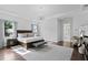 Spacious bedroom with a bed, chandelier and hardwood floors at 17124 Crawley Rd, Odessa, FL 33556