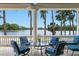 Covered patio area with seating and lake views at 17124 Crawley Rd, Odessa, FL 33556
