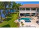 Luxury home boasting a beautiful pool, hot tub, and covered outdoor seating with stunning lake views at 17124 Crawley Rd, Odessa, FL 33556
