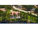 Expansive lakefront home with a private pool and lush greenery, ideal for outdoor entertaining at 17124 Crawley Rd, Odessa, FL 33556