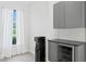 Wet bar featuring modern cabinetry, a beverage cooler, and a water cooler dispenser at 17124 Crawley Rd, Odessa, FL 33556