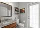 Stylish bathroom features granite countertops, vanity storage and access to the outside at 17318 Emerald Chase Dr, Tampa, FL 33647