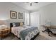 Bedroom with cozy furnishings, and large window with a view of the outdoors at 17318 Emerald Chase Dr, Tampa, FL 33647