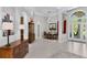 Spacious foyer with tall ceilings, tile floors and decorative columns leading to dining and living areas at 17318 Emerald Chase Dr, Tampa, FL 33647