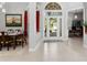 Bright foyer featuring neutral decor, tile flooring and seamless flow to other rooms at 17318 Emerald Chase Dr, Tampa, FL 33647
