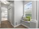 Bright hallway with decorative window seat and carpeting at 17318 Emerald Chase Dr, Tampa, FL 33647