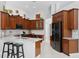 A spacious kitchen with granite countertops, stainless steel appliances, and custom wood cabinetry at 17318 Emerald Chase Dr, Tampa, FL 33647