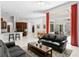 Spacious open-concept living space with modern furniture and access to the kitchen and dining areas at 17318 Emerald Chase Dr, Tampa, FL 33647