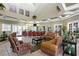 Clubhouse lounge area features leather sofas, area rugs, a bar, and elegant decor at 17318 Emerald Chase Dr, Tampa, FL 33647