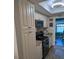 Bright kitchen featuring granite counters, tile backsplash, and stainless steel appliances at 1898 Shore S Dr # 311, South Pasadena, FL 33707