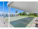 Shuffleboard courts with shade and water views for community residents at 1898 Shore S Dr # 311, South Pasadena, FL 33707