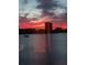 Vibrant sunset over the water, showcasing the city skyline and beautiful colors at 1898 Shore S Dr # 311, South Pasadena, FL 33707