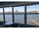 Stunning water view from the sunroom of a bay and pier with an urban skyline at 1898 Shore S Dr # 311, South Pasadena, FL 33707