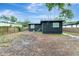 View of the back of the home showcasing the yard, and backyard at 1914 E Emma St, Tampa, FL 33610