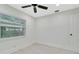 The bedroom features modern ceiling fan and window offering lots of natural light at 1914 E Emma St, Tampa, FL 33610