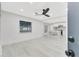 Bright open-concept living room and kitchen with modern finishes and stylish flooring at 1914 E Emma St, Tampa, FL 33610