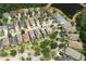 Aerial view showcases a property nestled among trees in a beautiful neighborhood with a nearby pond at 20039 Heritage Point Dr, Tampa, FL 33647