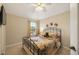 Comfortable bedroom features bright window, carpeted floors, and a ceiling fan at 20039 Heritage Point Dr, Tampa, FL 33647