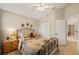 Cozy bedroom features a decorative wrought iron bed frame and a ceiling fan at 20039 Heritage Point Dr, Tampa, FL 33647